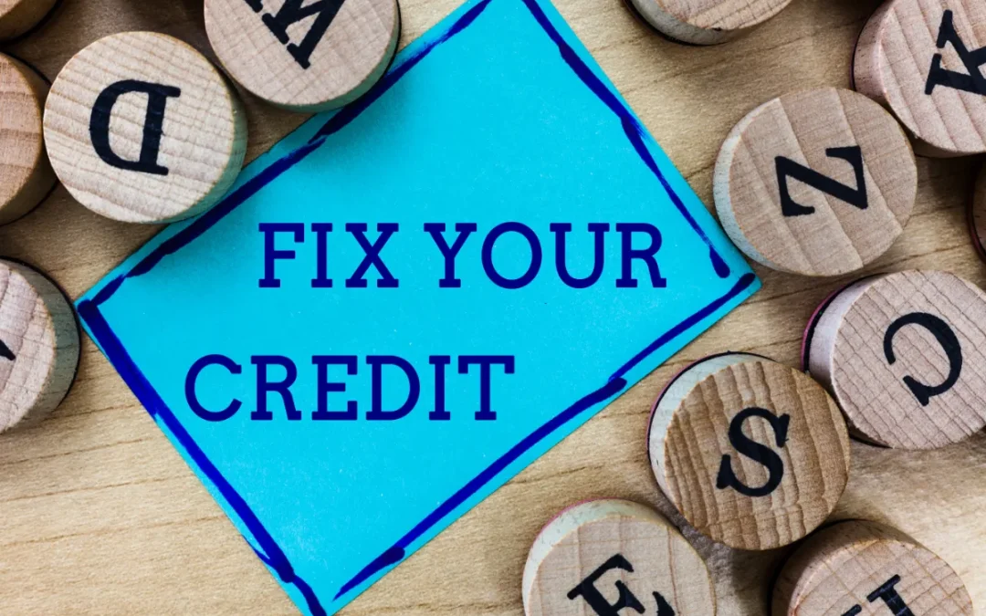 A sign reading 'FIX YOUR CREDIT' amidst scattered wooden letter tiles.